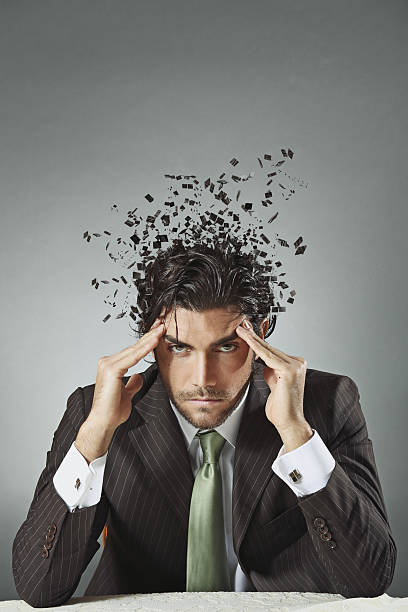 Businessman with scattered mind stock photo