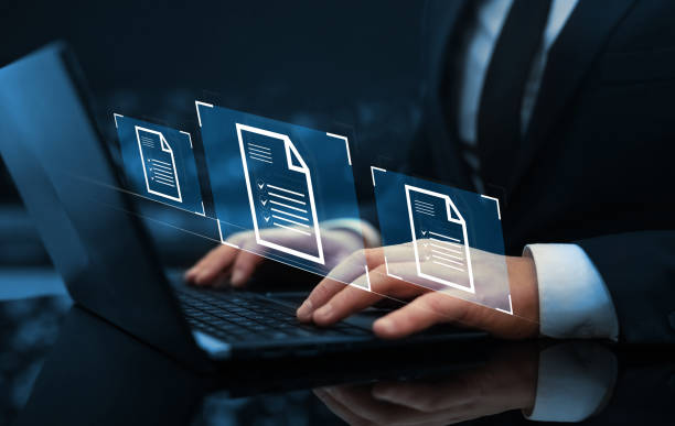 Businessman working at laptop computer and digital documents with checkbox lists. Law regulation and compliance rules on virtual screen concept stock photo