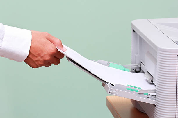 Businessman working with printer stock photo