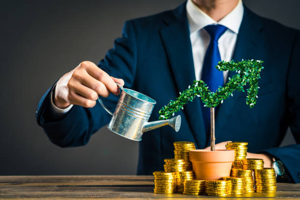 Businessmen with plants Businessmen with plants coin photos stock pictures, royalty-free photos & images