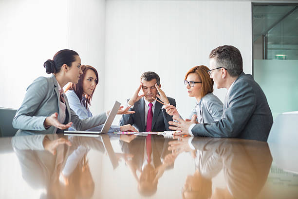 Businesspeople arguing in meeting Businesspeople arguing in meeting arguing photos stock pictures, royalty-free photos & images
