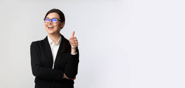 Businesswoman Gesturing Thumbs-Up Over White Background, Panorama Like Concept. Cheerful Businesswoman Gesturing Thumbs-Up Posing Over White Background In Studio. Panorama, Free Space business thumbs up stock pictures, royalty-free photos & images