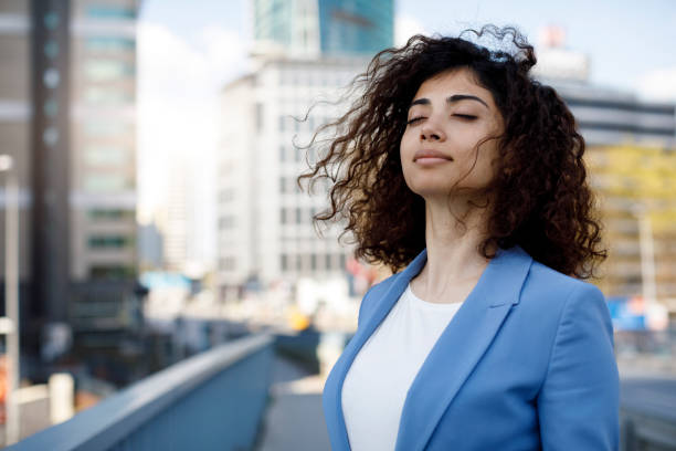 Businesswoman relaxing outdoor Businesswoman relaxing outdoor deep conditioning stock pictures, royalty-free photos & images