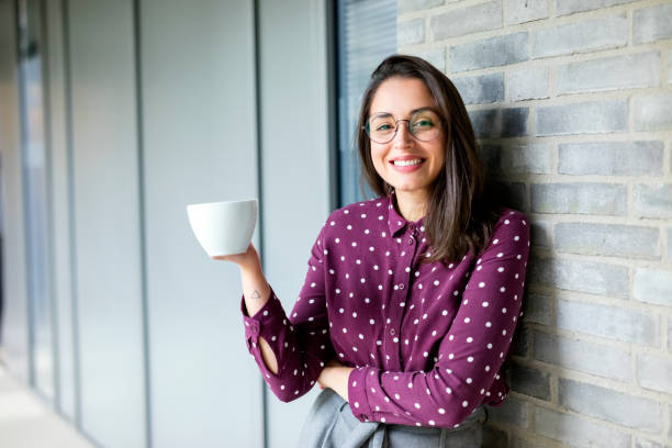Businesswoman taking coffee break stock photo
