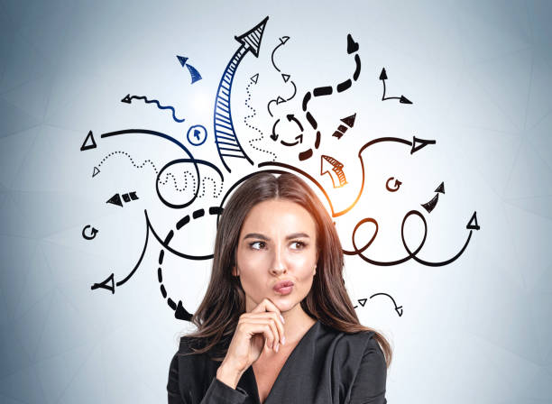 Businesswoman thinking, arrows with different direction, difficult choice stock photo
