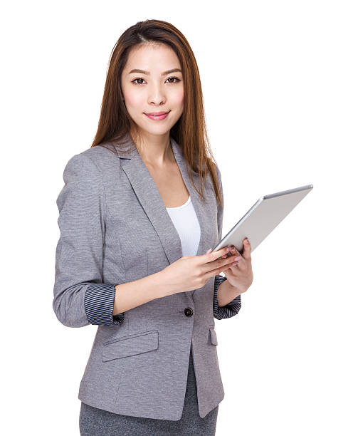 Businesswoman using a tablet stock photo