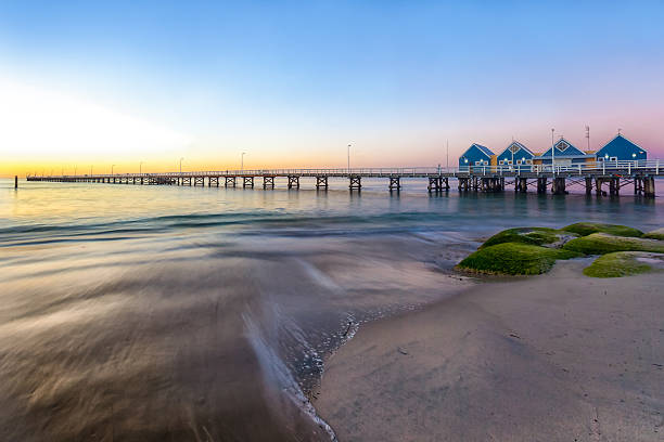 Busselton Jetty At Sunset A stunning image of the Busselton Jetty taken at Sunset. Situated near the City of Perth, in Western Australia, it is the longest wooden jetty in the Southern Hemisphere, stretching almost 2km out to sea. jetty stock pictures, royalty-free photos & images