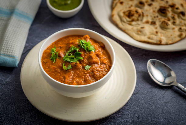 Butter Chicken - Indian Chicken Curry Dish Boneless Butter Chicken and Chapati served for dinner chapatti stock pictures, royalty-free photos & images