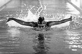 istock Butterfly style swimmer in action 505596486