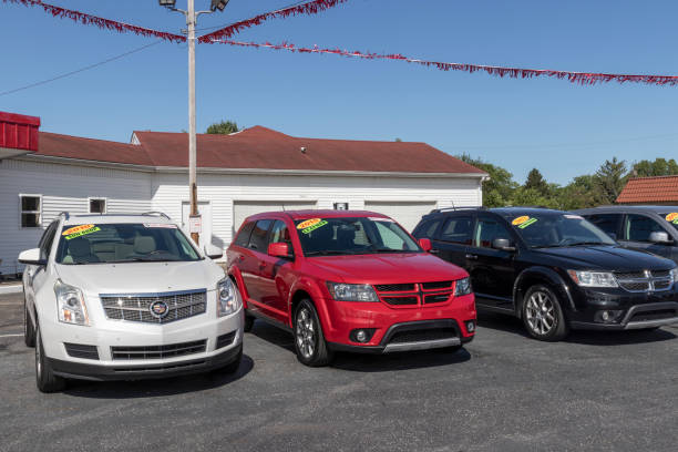 Buy Here Pay Here Used Car Dealer. Many buy-here, pay-here car dealerships do not require good credit but may track your car if you miss payments. stock photo