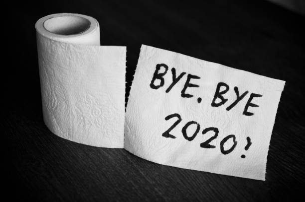 Bye bye 2020 and farewell on toilet paper Conceptual image of toilet paper, symbol of covid-19 crisis and pandemia in 2020. Abstract image, saying goodbye to the bad year, leaving the past behind, hoping for better. 2020 stock pictures, royalty-free photos & images