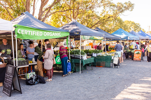 Byron Bay, Australia - September 17, 2014:  Various stalls selling goods at Byron Bay Farmers Market, Byron Bay, New South Wales, Australia