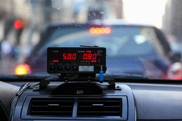 Cab rate meter display in a cab with a front window view stock photo