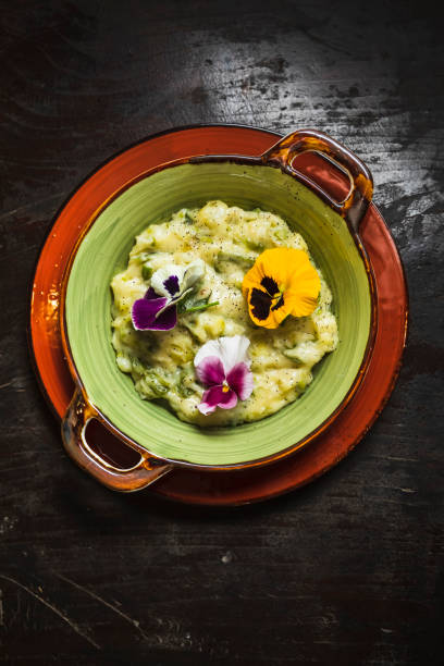 Cabbage and potatoes garnished with flowers stock photo
