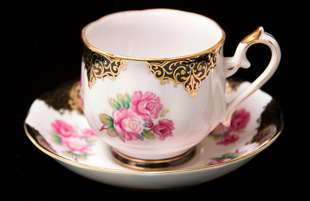Cabbage Rose teacup & saucer on black stock photo