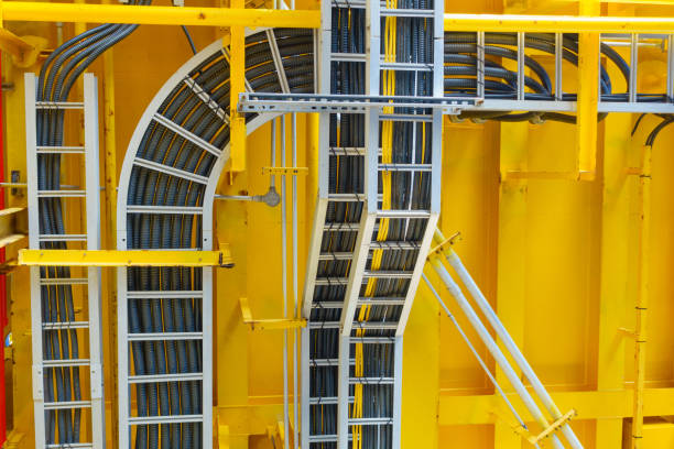 Cable tray with electrical wiring arrange on ceiling at offshore platform. stock photo