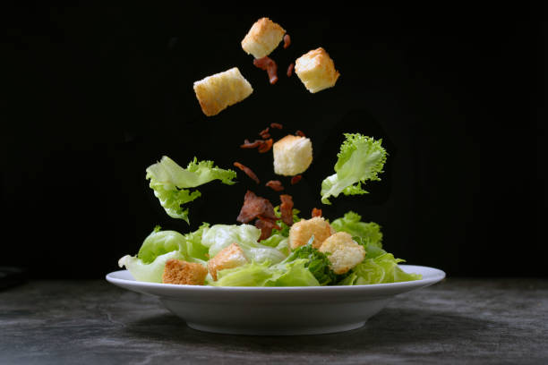 Caesar salad with crispy bread and bacon , Healthy food style stock photo