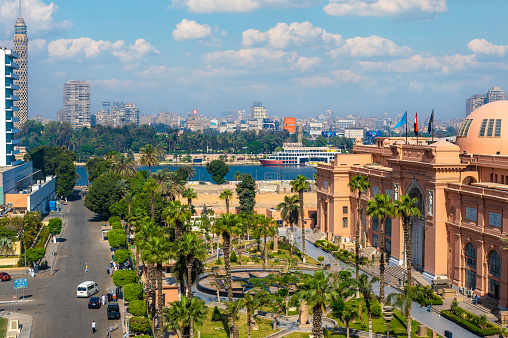 CAIRO, EGYPT - MAY 11, 2021 : Cairo Museum Of Egyptology And Antiquities. aerial view of Facade of the Egyptian Museum in Cairo and the Nile River