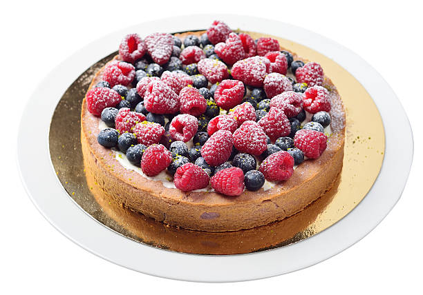 cake with raspberries and blueberries, isolated stock photo
