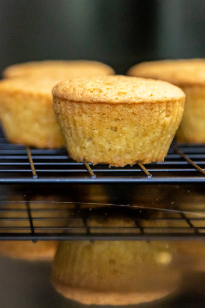 Cakes cooling on a rack, with a shallow depth of field stock photo