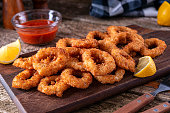 Delicious panko and black pepper crusted calamari rings with spicy marinara dipping sauce.