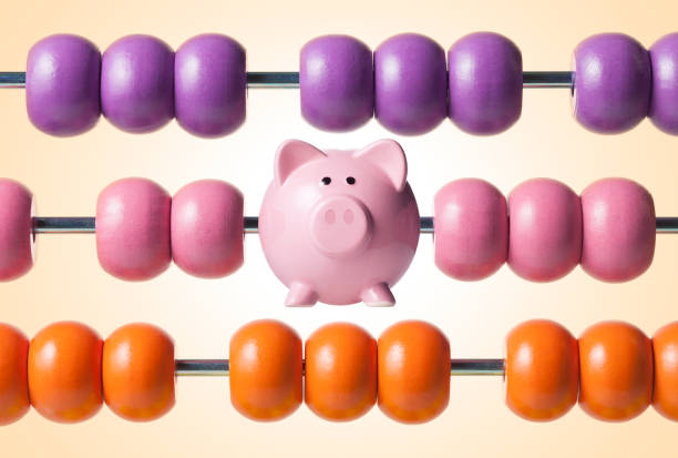 Calculate savings. Abacus with piggy bank. Abacus with piggy bank and colored beads. abacus stock pictures, royalty-free photos & images