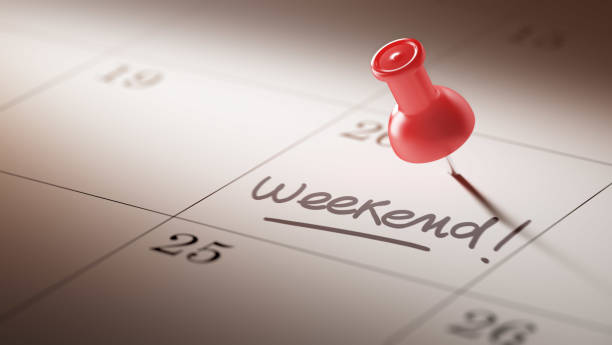 Calendar Concept with a red pin Concept image of a Calendar with a red push pin. Closeup shot of a thumbtack attached. The words Weekend written on a white notebook to remind you an important appointment. weekend activities stock pictures, royalty-free photos & images