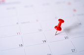 istock Calendar with red pins on the 20th, mark the date of the event with a pin. 1321236475