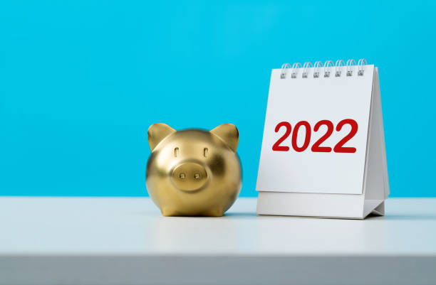 Calendar year 2022 and piggy bank on the table stock photo