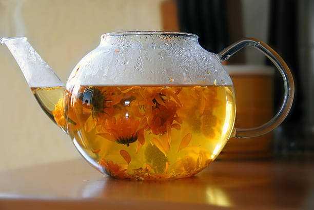 Calendula teapot stock photo