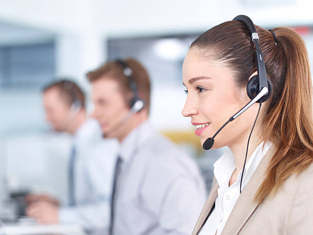 Call center operators working in office stock photo