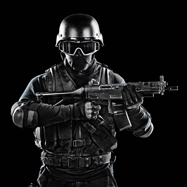 Call Of Duty Modern military soldier holding a rifle. Studio shot on black background. special forces stock pictures, royalty-free photos & images