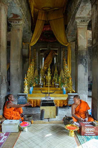 Cambodia. Siem Reap Province. Monks at Angkor Wat (Temple City). A Buddhist and temple complex in Cambodia and the largest religious monument in the world
