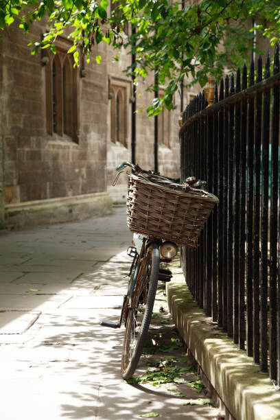 Cambridge Bicycle Leaning Against a Black Metal Fence stock photo