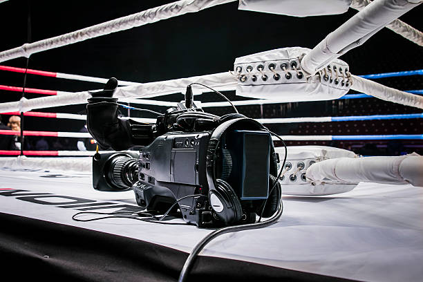 camcorder stands on corner ring for mixed martial arts stock photo