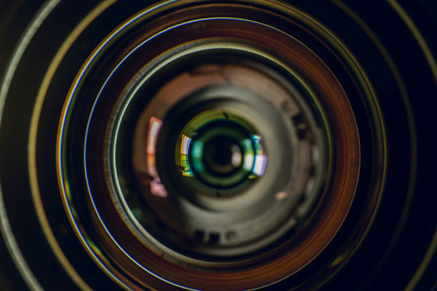 Camera lens on black background. Aperture blades. Camera lens close up Camera lens reflections in glass camera photographic equipment stock pictures, royalty-free photos & images
