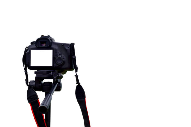Camera on tripod photographers take clipping path work Isolated white background stock photo