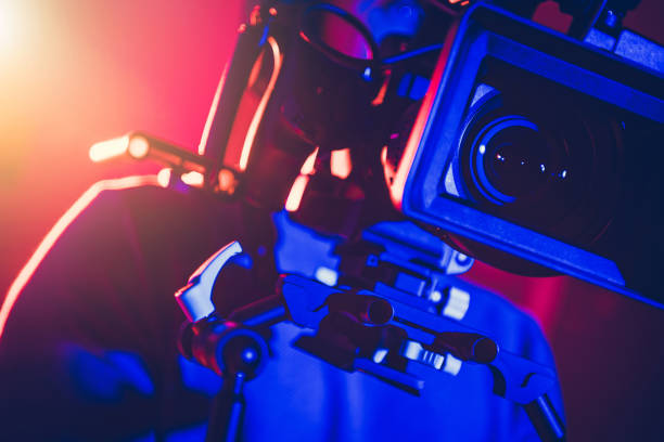 Camera Operator Behind Modern Digital Cinema Equipment stock photo