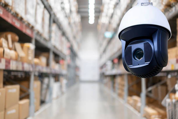 CCTV camera or surveillance operating in store or warehouse stock photo