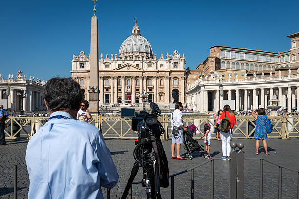 Cameraman places cam in front of St. Peter's Basilica Rome, Italy - September 2, 2016: Cameraman places his cam in front of St. Peter's Basilica in the Vatican City cam girl sites stock pictures, royalty-free photos & images