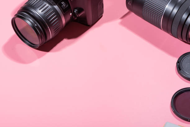 SLR cameras and accessories SLR cameras and accessories pink color photos stock pictures, royalty-free photos & images