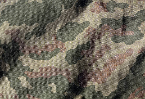 camouflage color cloth surface. - camouflage stockfoto's en -beelden
