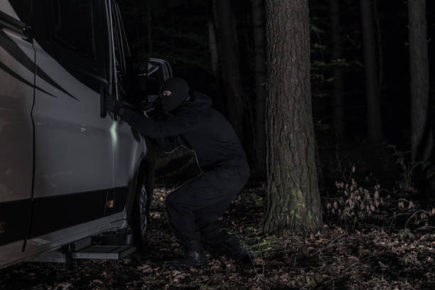 RV Camper Thief in Night Time Action stock photo