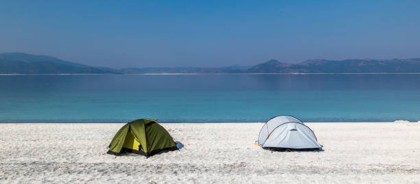 Camping on the White Beach and Turquoise Water of Lake Salda stock photo