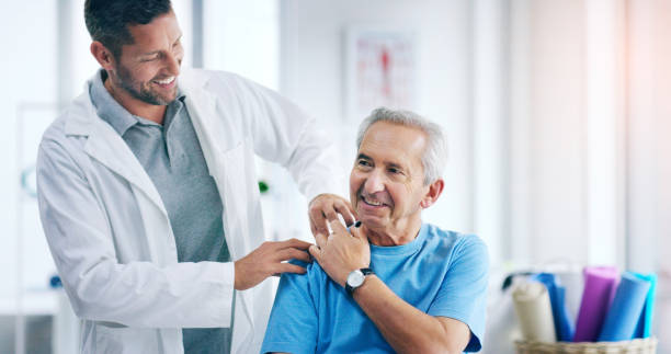 I can already feel the pain going away Shot of a male doctor doing some physiotherapy with a senior patient osteoporosis photos stock pictures, royalty-free photos & images