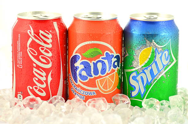 Can of Coca-Cola, Fanta and Sprite drinks on ice stock photo