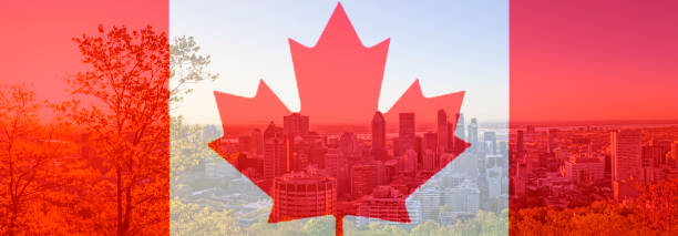 Canada Day flag with maple leaf on background of Montreal city. Red canadian symbol over buildings of Montreal town at Canada National Day of 1st July. stock photo