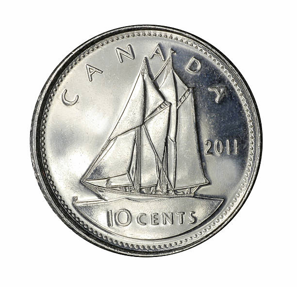 Canadian dime Ottawa, Canada - January 1, 2015:  A  Canadian ten cent coin, depicting the famous Nova Scotian racing schooner Bluenose. dime stock pictures, royalty-free photos & images