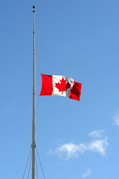Canadian flag at half mast In honour of soldiers killed in Afghanistan. flag at half staff stock pictures, royalty-free photos & images