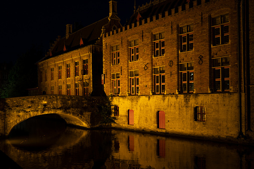 Bruges, Belgium - Septmeber 12 2021: a picturesque scene in Brugge at nighttime. Brugge is the capital of West Flanders in Belgium.